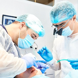 dentists conducting dental surgery