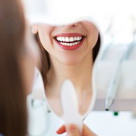 Patient looking at smile in mirror