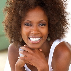 Woman with a dental crown smiling