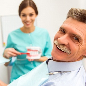 man at a consultation for dentures in Wheaton