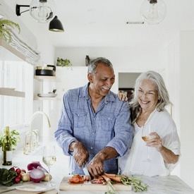 couple cooking together in their kitchen