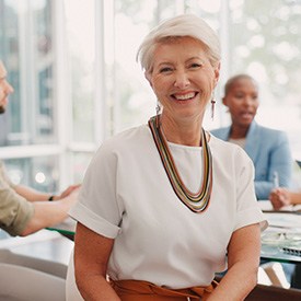 Wheaton patient smiling confidently at work