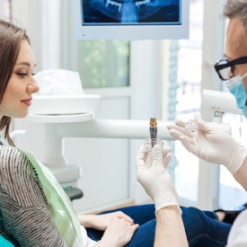 Dentist explaining dental implant