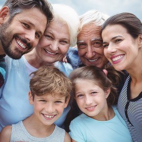 Three generations of family smiling together