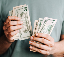 Man’s hands counting cash